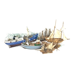 Six various wooden hulled model boats including sailing ships and fishing boats, various stages of condition and completeness, some requiring restoration, largest L82cm