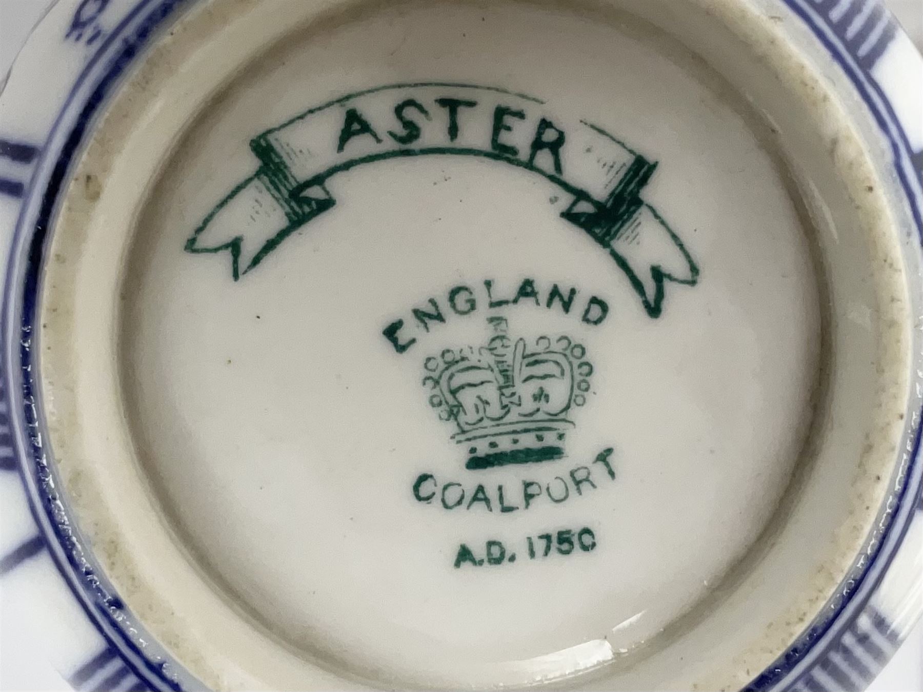 Late 19th century Coalport porcelain cup and saucer in the 'Aster' pattern bearing the crest of Express Dairy Company Limited, College Farm, Finchley and decorated with a steam locomotive