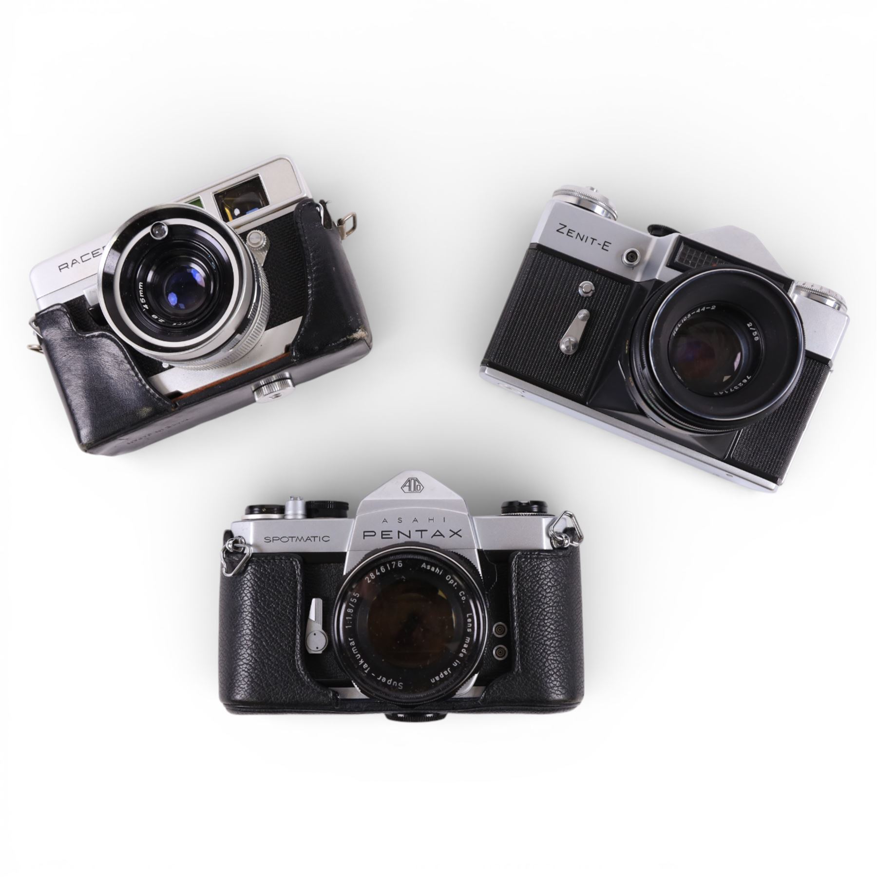 Asahi Pentax Spotmatic 35mm SLR camera, with Super-Takumar 1:1.8/55 lens, Petri Racer rangefinder camera and a Zenit-E camera, all in leather cases