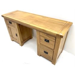 Light oak twin pedestal desk one shallow and two deep drawers, single cupboard, stile supports 