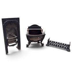 Three cast iron fireplace fittings, comprising a Regency-style fire grate with sunburst cr...