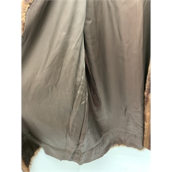 A lined Musquash fur coat. 