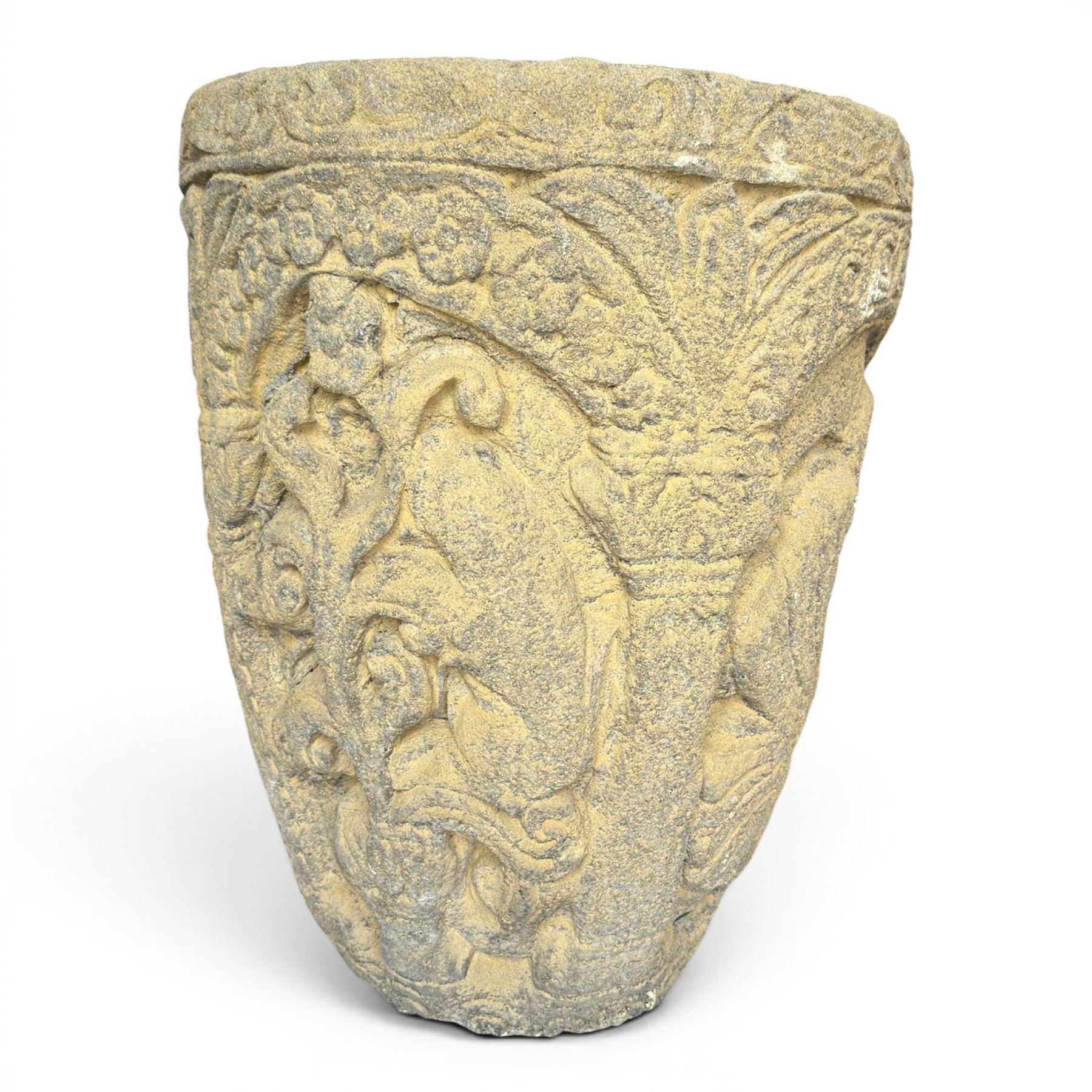 Cast stone Romanesque design urn of tapering form, decorated in relief with motifs of zoomorphic figures and swans within foliate and guilloche cast architectural arches with Neoclassical columns, in weathered finish