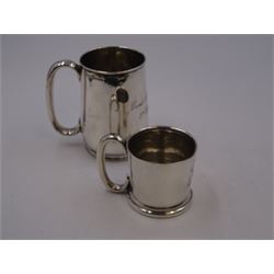 Early 20th century silver christening mug, of tapering cylindrical form, with C handle and personal engraving to centre, upon stepped base, hallmarked Chester 1913, maker's mark worn and indistinct, together with a Victorian silver christening mug, of slightly tapering form, with C handle, later personal engraving to centre and beaded rim to base, hallmarked James Dixon & Sons Ltd, Sheffield 1880, tallest H9cm