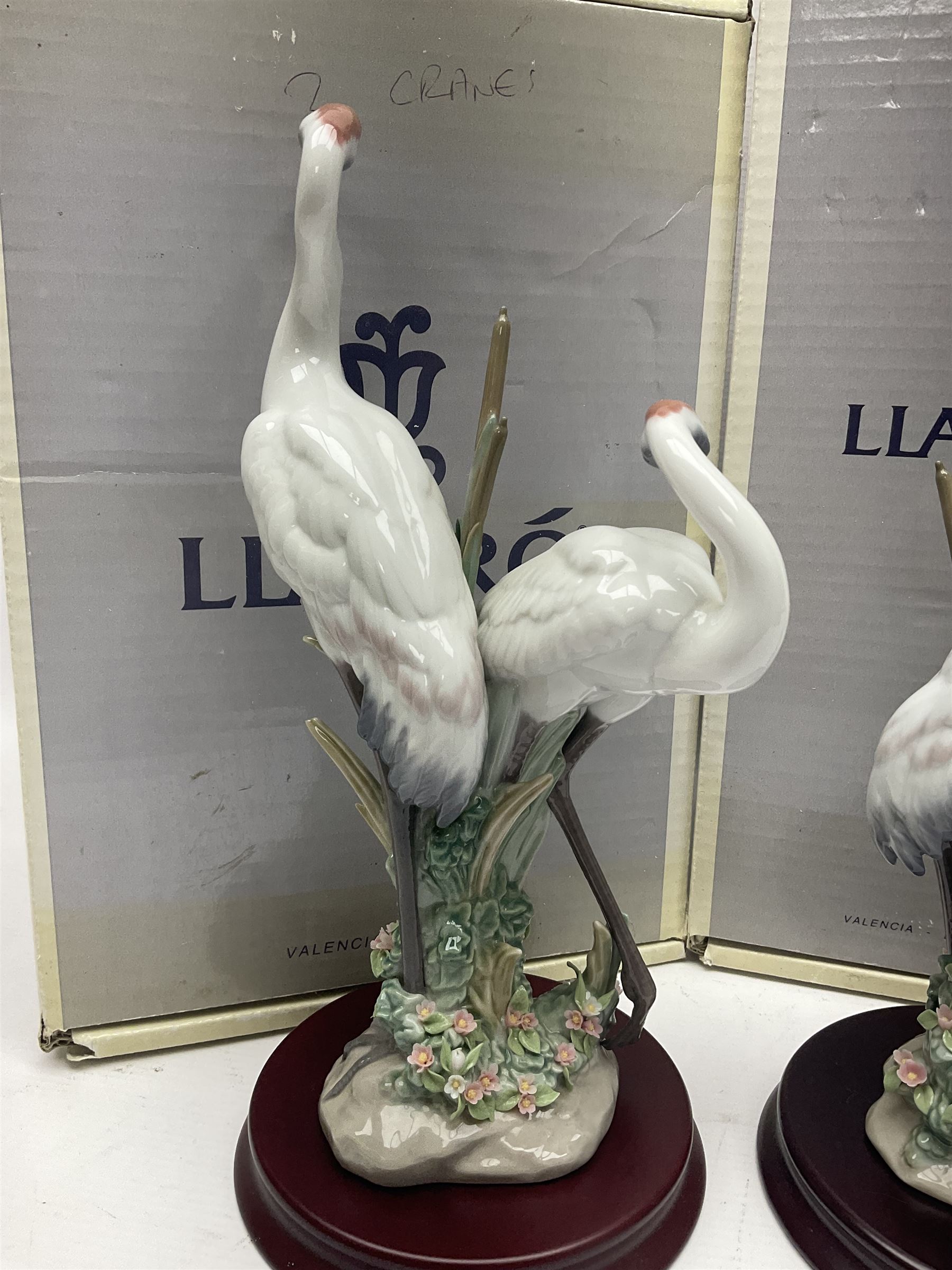 Two boxed Lladro figures, comprising courting cranes no 1611 and dancing crane no 1614, both with original boxes 