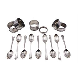 Set of nine 1930's silver golfing terminal coffee spoons, hallmarked Walker & Hall, Sheffield 1933, and Chester 1933, together with a group of six 20th century silver napkin rings, to include a pair of oval mid 20th century examples, hallmarked Lanson Ltd, Birmingham 1950, approximate total weight 6.96 ozt (216.6 grams)