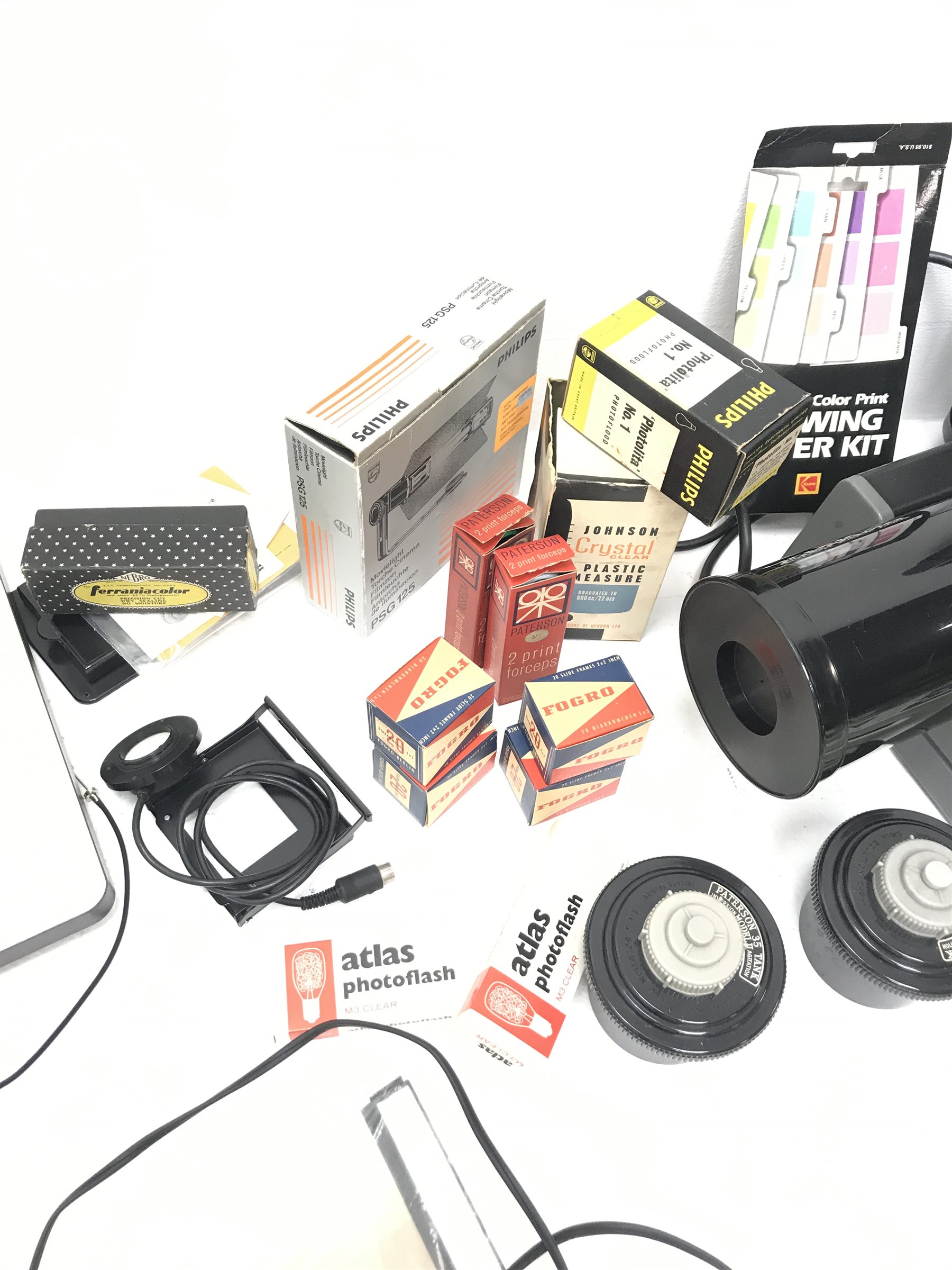 Large quantity of photo developing, dark room and photography equipment - quantity of Fogro 2'' x 2'' slide frames, PHILIPS movielight PSG125, Paterson 2 print forceps, atlas photo flash M3 clear, two Paterson 35mm developing tanks, Ilford photography paper 12'' x 16''and 8'' x 10'', Fujifilm photography paper 8'' x 10'' and 12'' x 16'', Rondinax 35U developing tank boxed, Simma Roller, two Ilford processing drums 30x40cm and 20x25cm, two other processing drums, Paterson 35mm contact proof printer, S&K 60D-C colour analyser etc... in three boxes