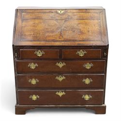 18th century inlaid oak bureau, the fall-front with central star inlay enclosing fitted in...