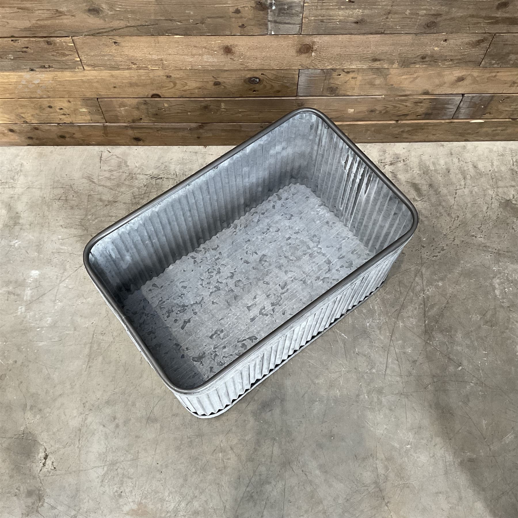 Set of three pressed metal planters in different sizes