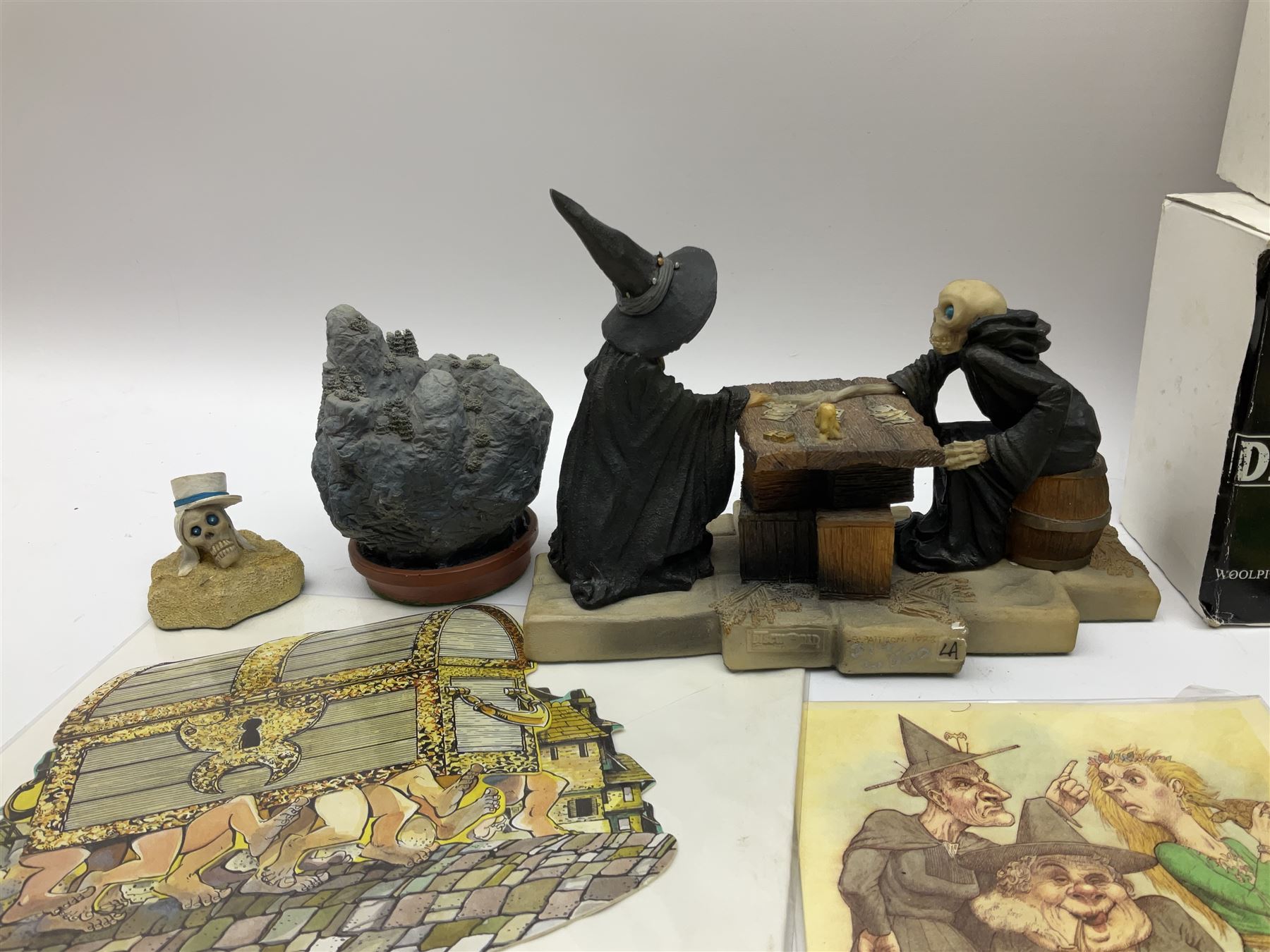 Terry Pratchett Discworld figures, designed by Clarecraft, comprising Death and Granny Weatherwax, DW90, Deathhead DWE8, Dried-frog pill box, boxed, DW63, Death as Beau Nidle, boxed, DW88, Agnes Nitt DW68, Detritus, DW22, Bonsai mountain, DW78, Volcanic bonsai mountain, boxed, DW79, Bonsai mountain valley, DW80, together with the Discworld mapp, and a collection of Terry Pratchett cards.  