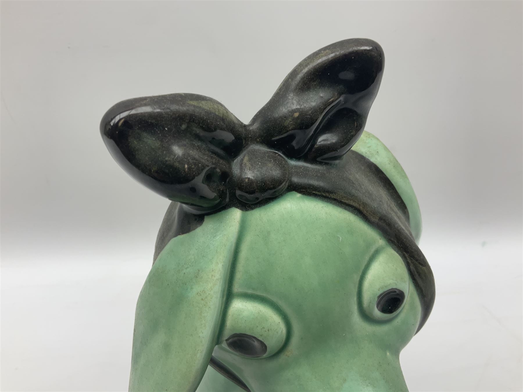 Sylvac 'toothache' dog in the green colourway, no 2451, with impressed beneath, H28.5cm