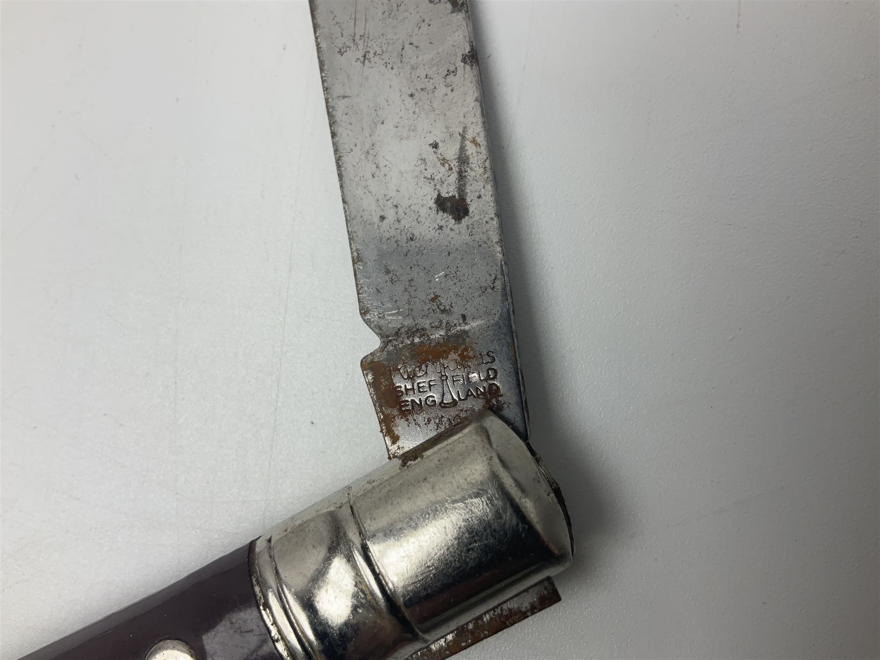 Seven pen knives, two lighters, including one Ronson example and a collection of postcards