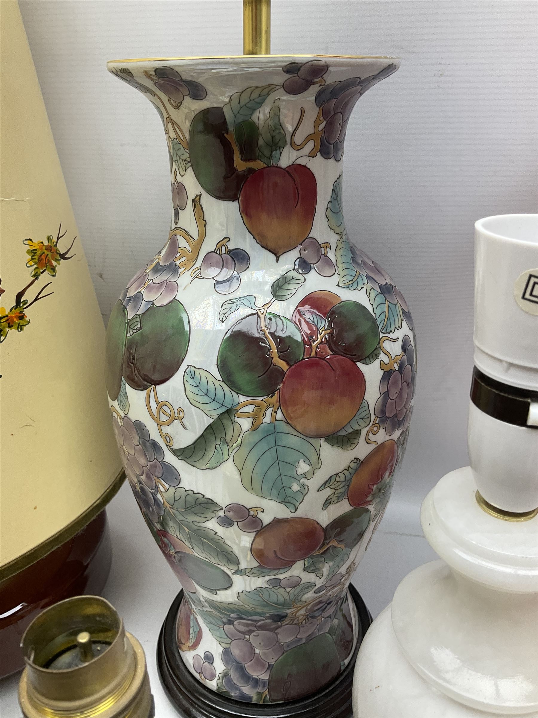 Collection of table lamps to include one of baluster form, decorated with fruit, one of squat, with a hand painted lampshade, and two standard lamps