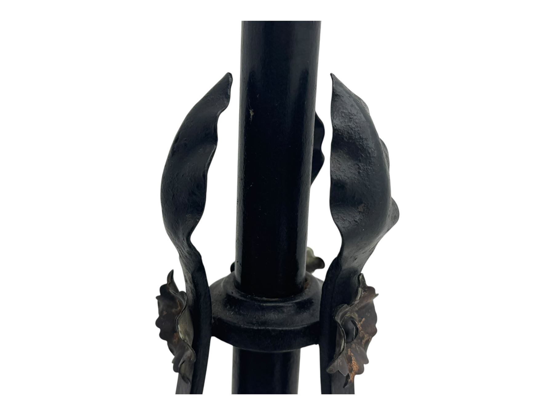 Late 19th century wrought iron and brass pulpit lamp, featuring an adjustable stem with a spiral twist detail, brass foliate mounts, and a tripod base with scrolled feet and decorative floral accents