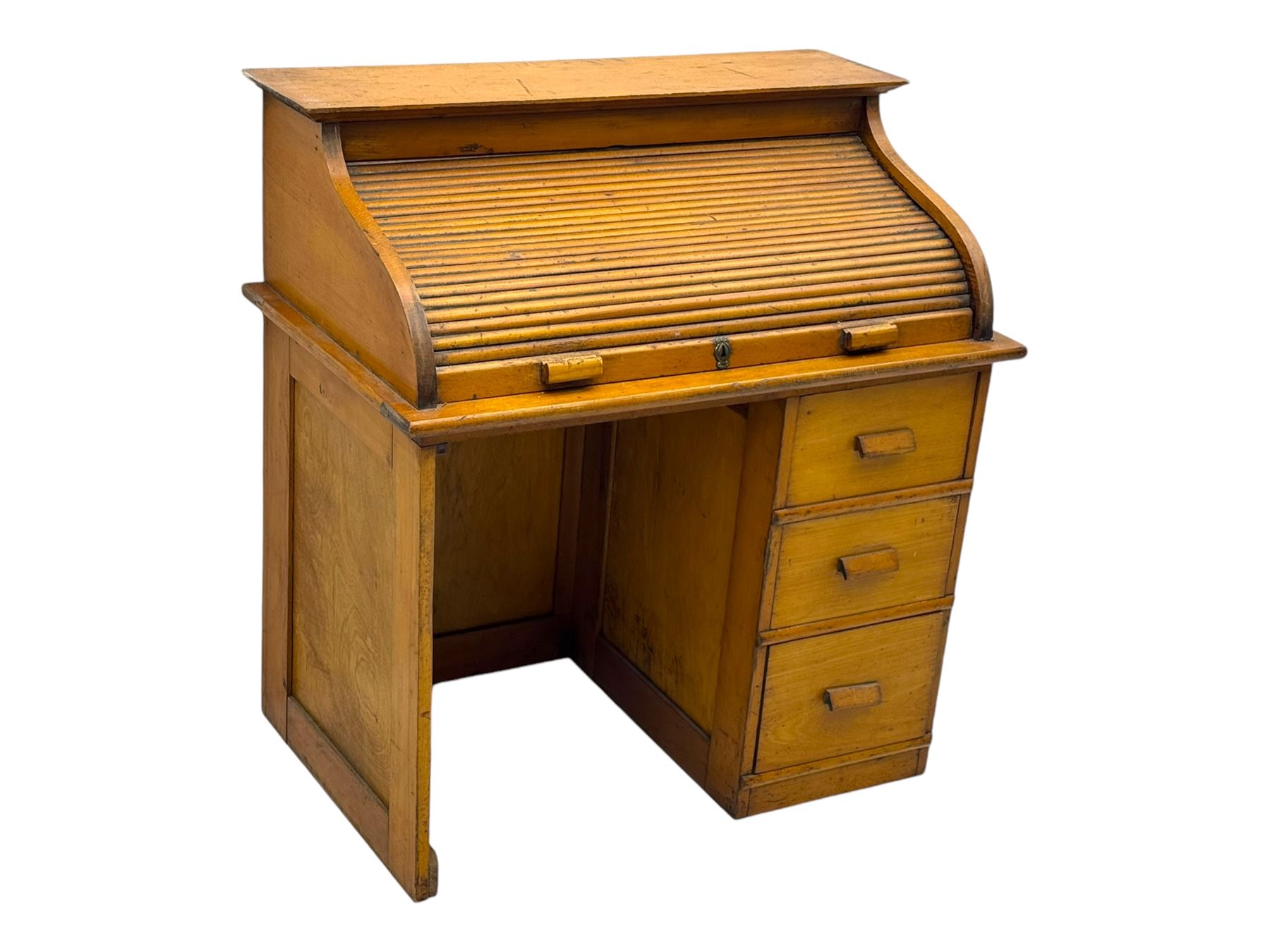 Leeway - late 19th century light oak child's roll-top desk, tambour top opening to reveal fitted interior with green felt writing surface and five pigeonholes, over three graduated drawers on the right side, raised on panelled side supports