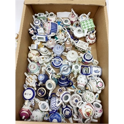 A large collection of miniature teapots, mostly by Porcelain Art. 