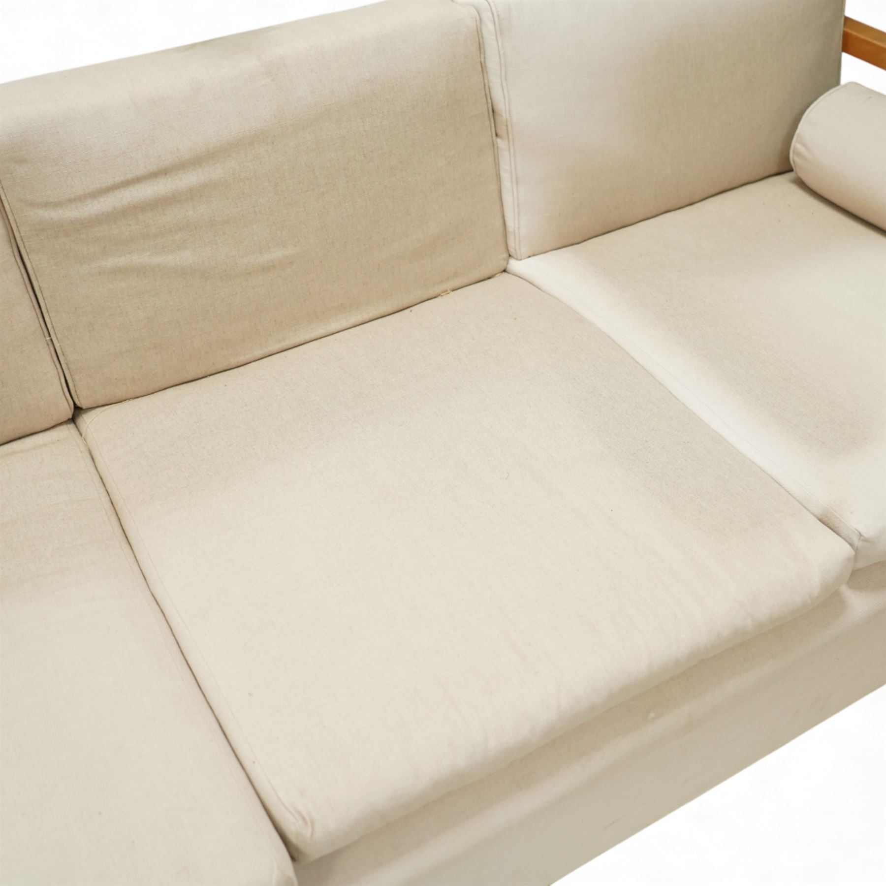 Mid 20th century German Art Deco oak framed divan day bed, rectangular form with slatted side supports, upholstered in cream linen with three removable back cushions, three seat cushions and cylindrical bolster arms, on block feet