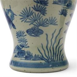 Pair of Chinese blue and white jars and covers, of baluster form, painted with fish and foliage H36cm