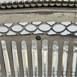 Early 20th century Dutch silver basket, of oval form with pierced sides, beaded rim, and twin handles, marked with Lion Passant for 2nd standard purity and date letter for 1910, other marks worn and indistinct, including handles H8.5cm L25.5cm
