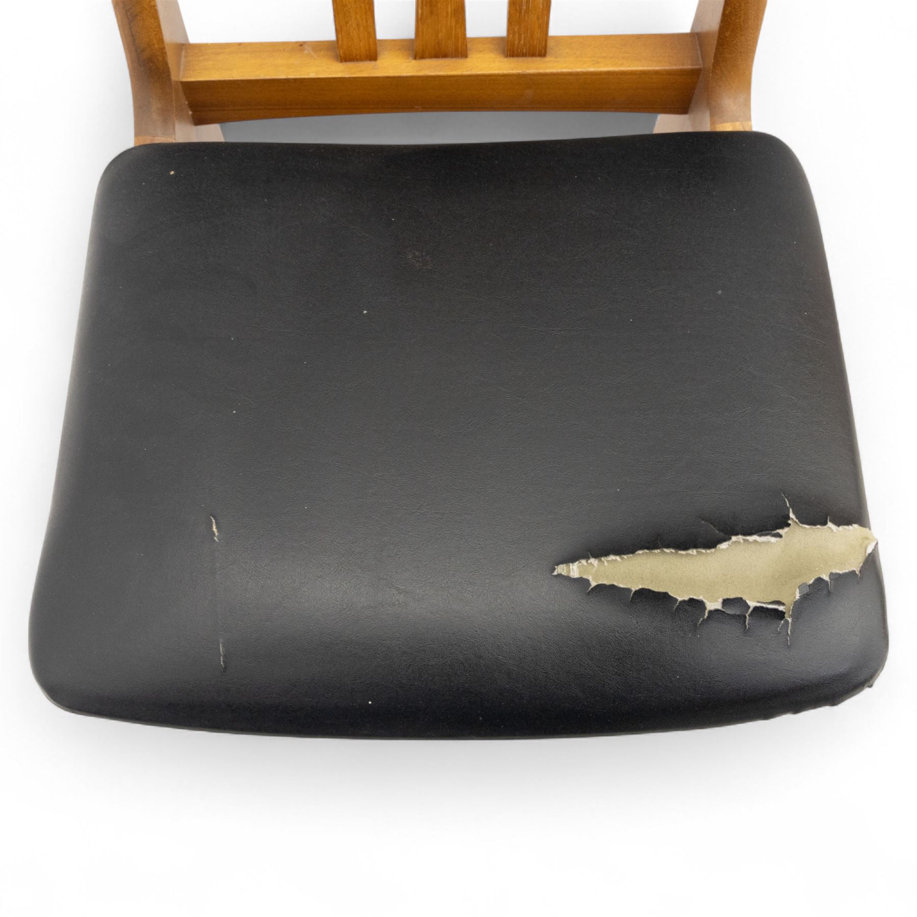 Sutcliffe of Todmorden - mid 20th century ‘S-Form’ teak dining table and chairs, the circular storable extending table with plain veneered top on tapered supports, together with matching dining chairs upholstered in black vinyl, with curved slat backs and shaped front supports, reflecting the sleek organic styling characteristic of 1960s British modern furniture design (Chairs H 93cm, W 46cm, D 46cm) (Extended 168cm)