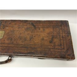 Leather shotgun case, the red baize lined interior with the trade labels of Westley Richards & Co., London, a brass plaque inscribed 'T Nevin, Mirfield, Yorkshire' to cover, with key, case to fit barrel 76cm (30 inches)  
