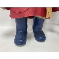 Pair of Paddington Bear teddies with amber eyes, the first example having a brown felt hat, red coat and blue PB boots with original label; the second having a grey felt hat, blue coat and blue Dunlop boots, tallest H51cm 