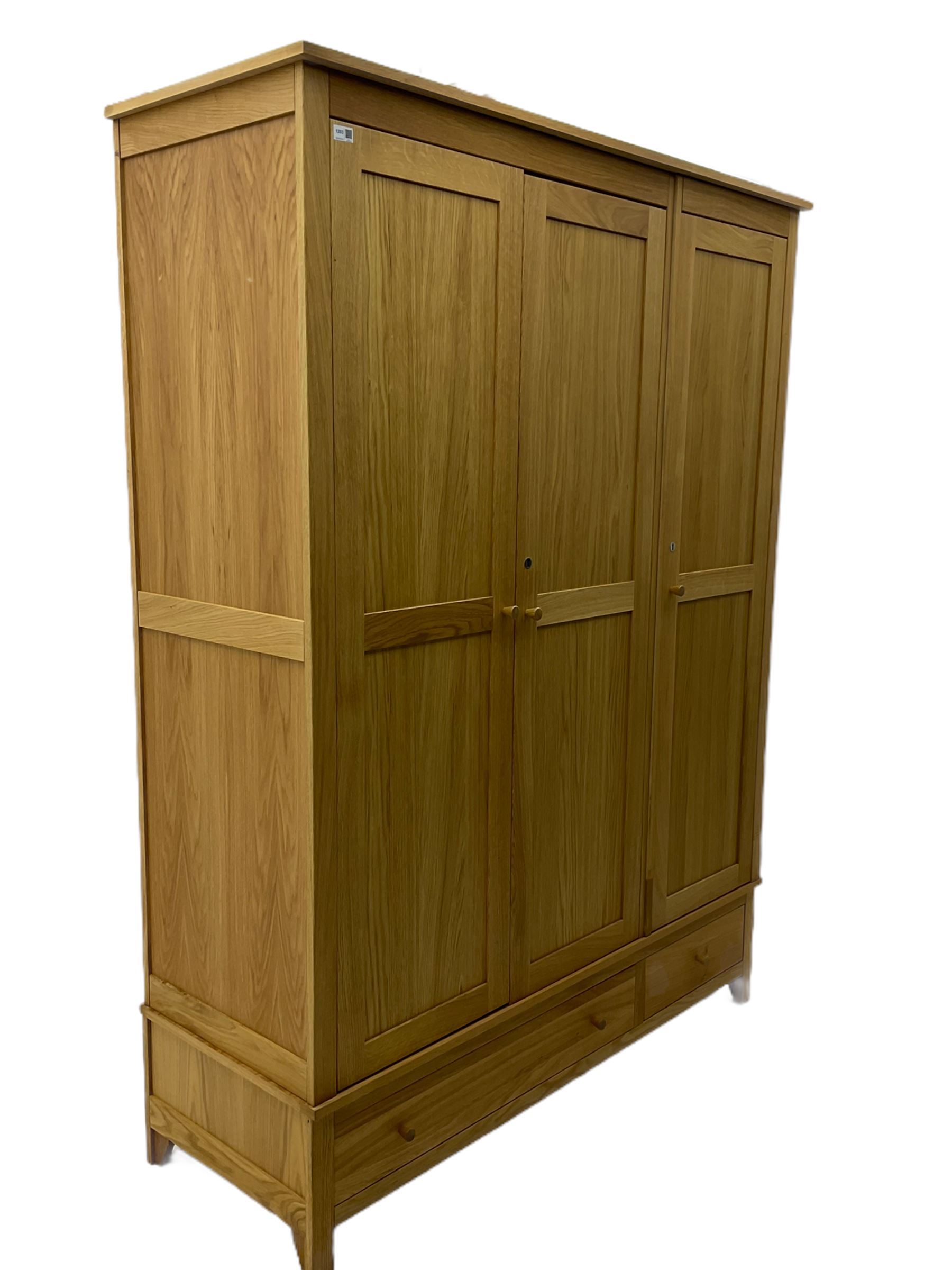 Corndell Furniture - light oak triple wardrobe, enclosed by three panelled doors, one long and one short drawer