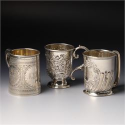 Edwardian silver christening mug with engraved decoration H8cm Birmingham 1902 and two oth...