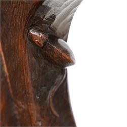 Mouseman - circa. 1920s adzed oak settle or bench, the cresting rail carved with inscription 'Before Honour is Humility', four panel back and plank seat on shaped end supports carved with grotesque masks terminals, carved with mouse signature, by Robert Thompson of Kilburn 
