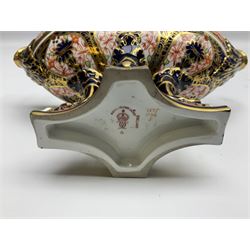 Early 20th century Royal Crown Derby Imari 1128 pattern pedestal dish, the boat shaped bowl with high scroll handles, upon four scroll supports and quatrefoil base, with printed mark beneath including year cypher for 1917, H13cm W19.5cm

