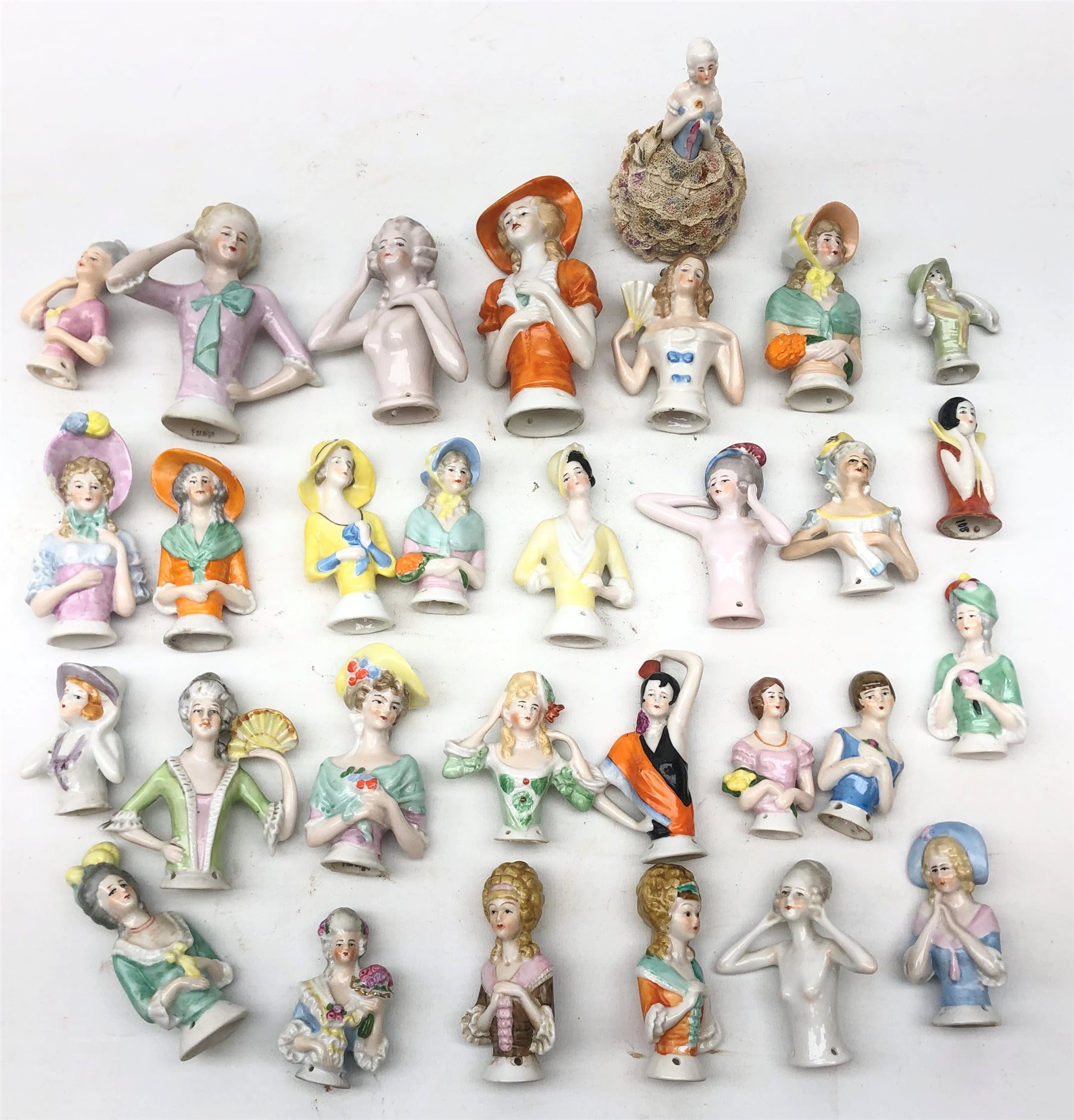 Collection thirty of ceramic pin cushion half dolls of varying