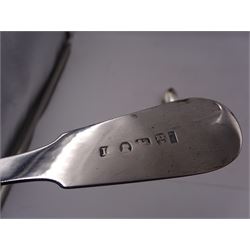 Georgian silver Fiddle pattern table spoon, with engraved initial to finial, hallmarked John Walton, Newcastle, 1801 or 1825, together with a set of six George III silver Fiddle pattern teaspoons, hallmarked Thomas Wallis (II) & Jonathan Hayne, London 1810 