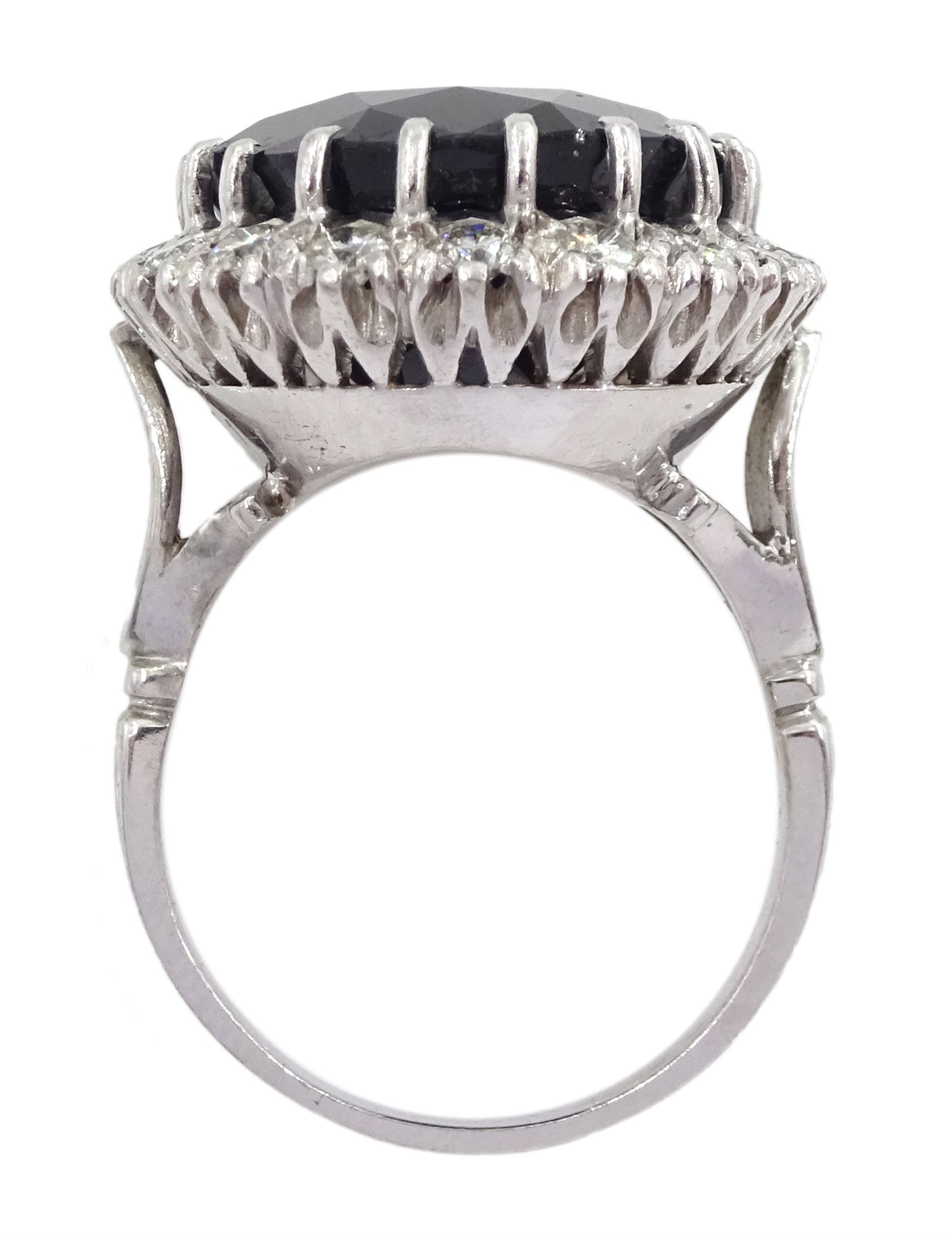 18ct white gold large oval sapphire and round brilliant cut diamond cluster ring, sapphire approx 27.35 carat, total diamond weight approx 1.00 carat