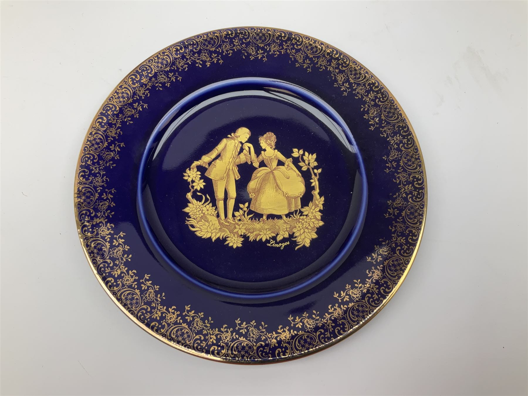 Royal Doulton toby jug of Winston Churchill H23cm and large character jug of Falstaff; together with four collector's plates by Royal Crown Derby, Royal Worcester and Limoges (6)