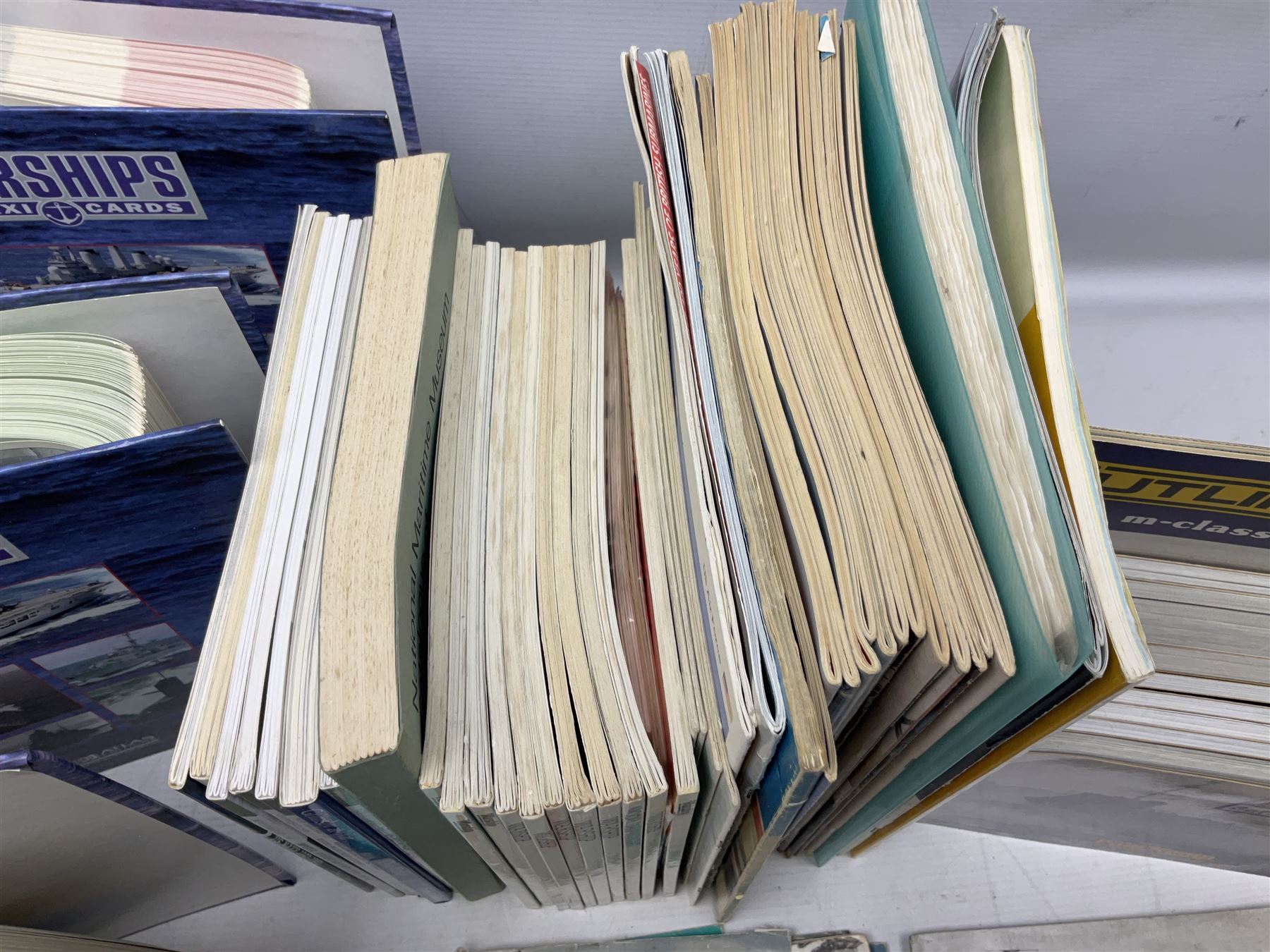 Six Atlas Editions ring binders of Warships Maxi Cards; and large quantity of booklets, cigarette cards etc of naval and shipping interest