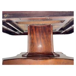Victorian mahogany tilt-top table dining table, rounded tilt rectangular top with moulded edge, on octagonal column, raised on shaped quadriform base with bold scrolled feet