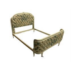 French style 4' 6'' double bedstead, the painted moulded frame with ribbon crossover detail, floral carved cresting rail, upholstered and buttoned in patterned fabric 