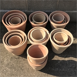 A quantity of approx. 24 tapering terracotta plant pots - various sizes