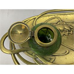 Art Nouveau Geschutzt brass desk stand, with stylised whiplash relief decoration, with removable Loetz style green glass inkwell, stamped to the base, H8cm