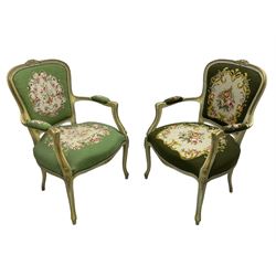 Near pair of French Louis XVI design lacquered hardwood-framed parlour elbow chairs, moulded flower head cresting rail over scrolled arm terminals, back and seat upholstered in green and olive floral and urn decorated tapestry fabric, on cabriole supports, in craquelure cream finish with painted gilt piping