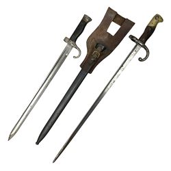  French Model 1892 Mannlicher Berthier bayonet with 39.5cm fullered blade; in metal scabbard with leather frog L54cm overall; and French Model 1874 epee bayonet (no scabbard) (2)