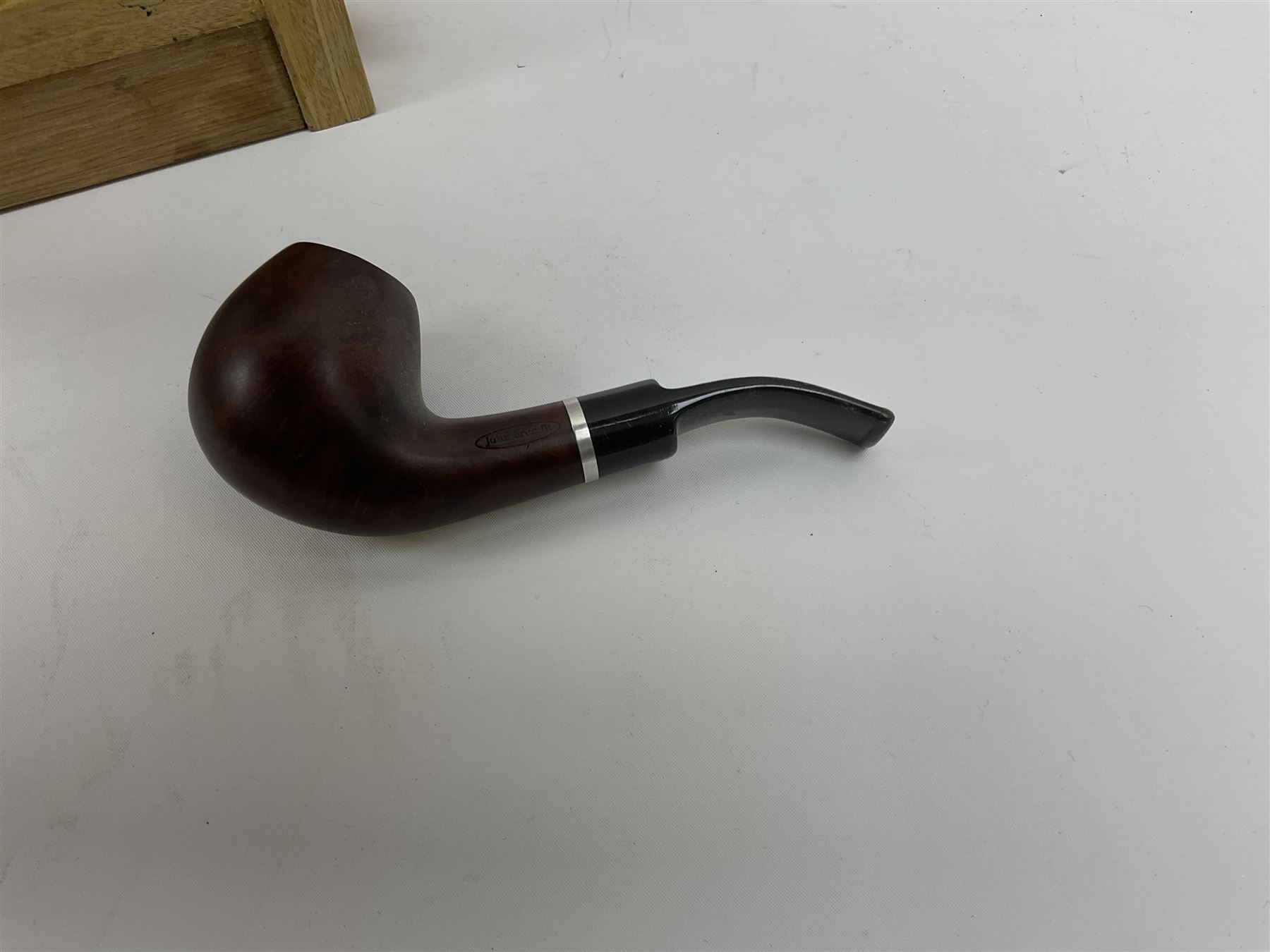Pipes and two tiered wooden rack together with eleven pipers, including briar pipe carved as a wolf, Sea Dog straight pipe, John Brumfit pipe, meerschaum pipe ect, pipe rack H29.5cm