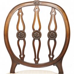 Set of six (4+2) late 19th to early 20th century Hepplewhite design mahogany dining chairs, moulded oval framed back with three shaped and pierced upright rails decorated with floral carved roundels, upholstered in pale fabric, on square tapering supports with recessed panels and block feet 