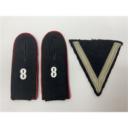 Collection of eleven German metal and cloth badges and uniform buttons including driver's badge, two 'SS' fabric skulls, private's shoulder tabs, Police cloth badge, tank destruction badge, medal bars and ribbon etc; most WW2 period