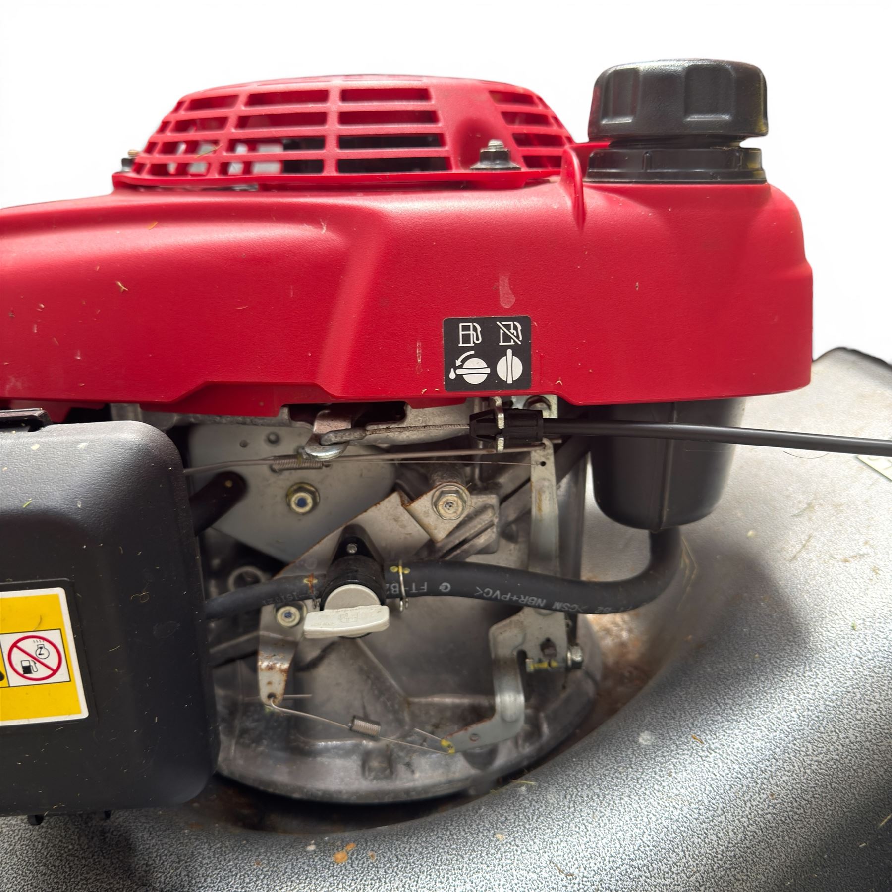 Honda -  GCV160 petrol lawnmower, Izy model, with rear grass collector, grey deck and red engine cover.