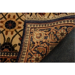  Brick red ground rug with hooked lozenge field, (126cm x 179cm) and hand knotted, Persian pattern wool rug with blue border and foliage filled field, (93cm x 169cm)   