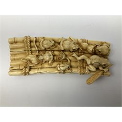 Meiji period Japanese ivory okimono, carved as six frogs with inset eyes rowing a rope bound bamboo raft, with character signature beneath, L15cm