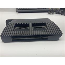 Sinclair ZX Spectrum (1984) with accessories and games; ten games for Sinclair Spectrum and 48K Spectrum to include ‘Knight Lore’, ‘The Way of the Exploding Fist’, and ‘Green Beret’ all in original boxes, ‘Rambo First Blood Part II’ without original box; Sinclair UK1400 Power Supply Unit, Hales Universal Mains Adapter, RAM Turbo Spectrum Joystick Interface, Starlite Cassette Player, all without boxes