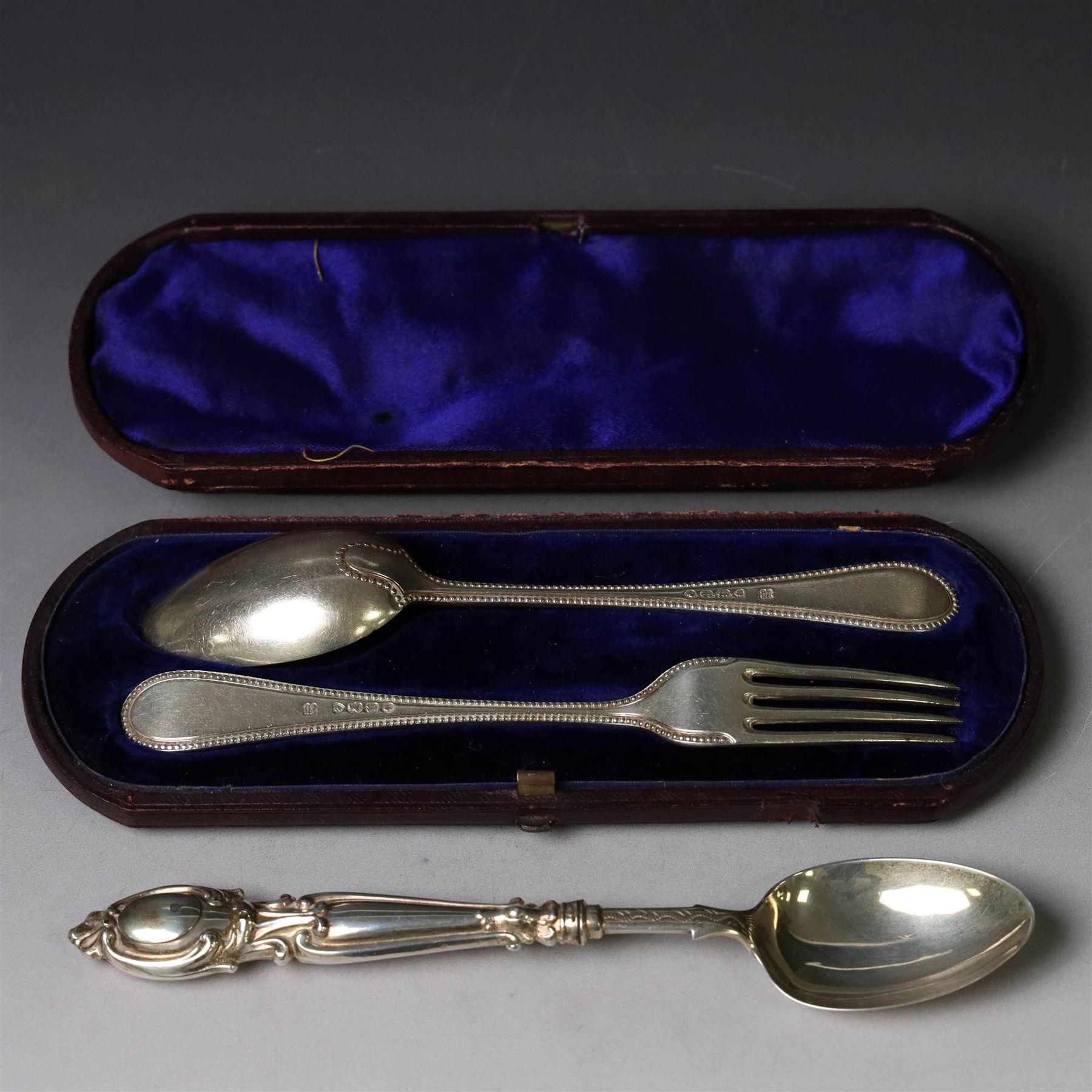 Victorian silver spoon and fork set, each with bead rim and engraved monogram and a silver spoon with scroll handle, with bright cut engraving to underside of bowl, all hallmarked 
