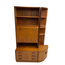 G-Plan - mid-20th century teak wall unit, fall-front enclosing fitted interior over three drawers, and corresponding corner unit, fitted with three open shelves over cupboard